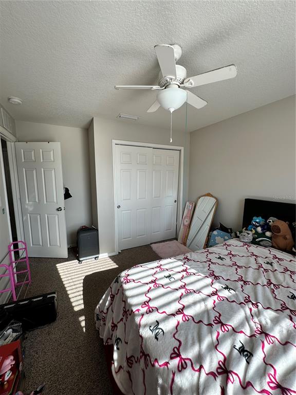 4411 Banyan Tree Place Riverview, FL 33578 - Photo 19 of 27 a bedroom that has a bed and a chandelier