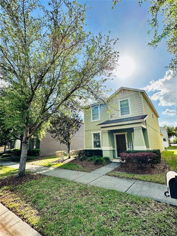 4411 Banyan Tree Place Riverview, FL 33578 - Photo 3 of 27 a front view of a house with garden