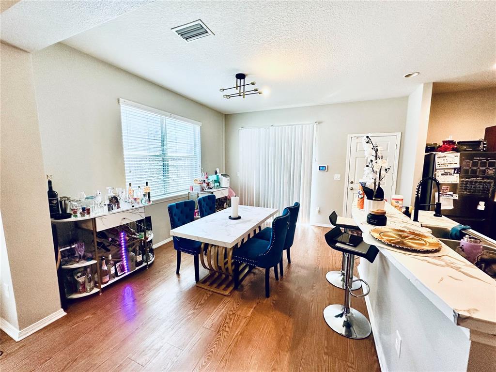 4411 Banyan Tree Place Riverview, FL 33578 - Photo 7 of 27 a living room with furniture and wooden floor