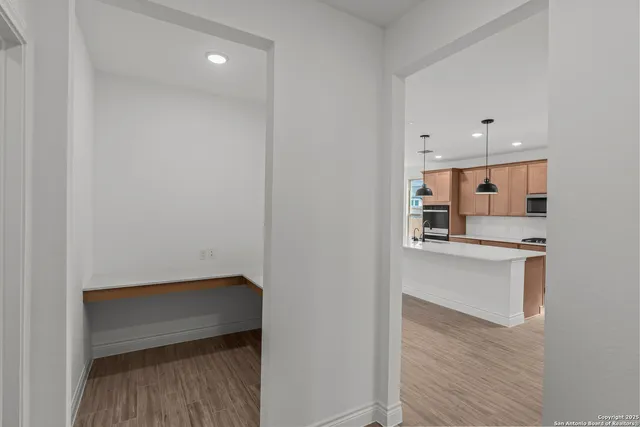 a view of kitchen with wooden floor