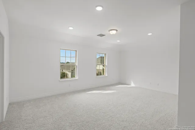 an empty room with windows