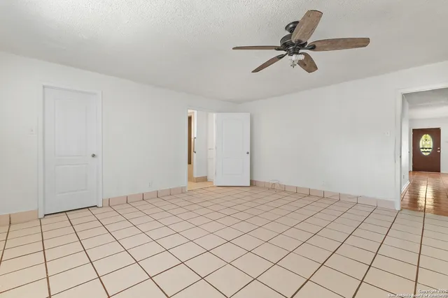 a view of an empty room and window