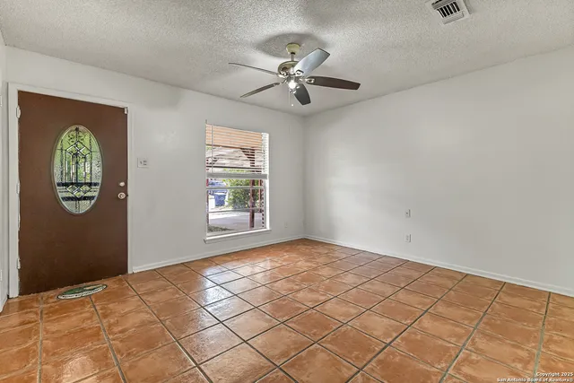 a view of an empty room and window