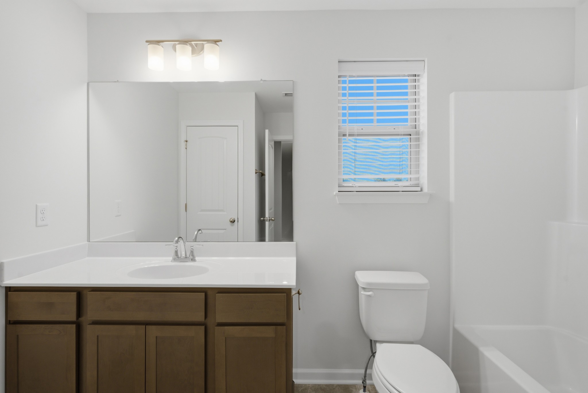 4015 Colleton Lane Murfreesboro, TN 37153 - Photo 24 of 34 a bathroom with a toilet a sink and mirror