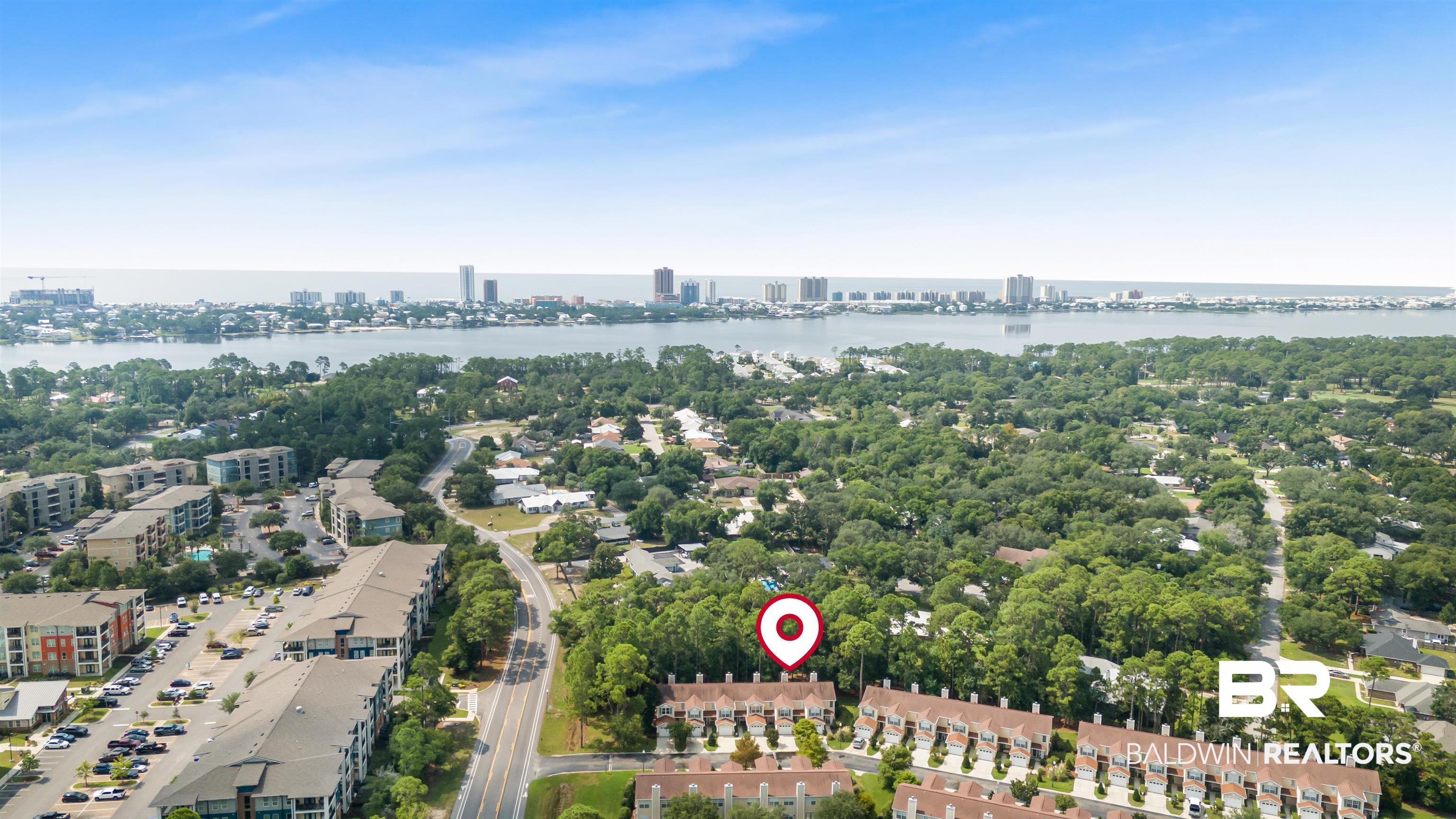 1517 Regency Road, Unit 85 Gulf Shores, AL 36542 - Photo 29 of 32 Drone / aerial view featuring a water view