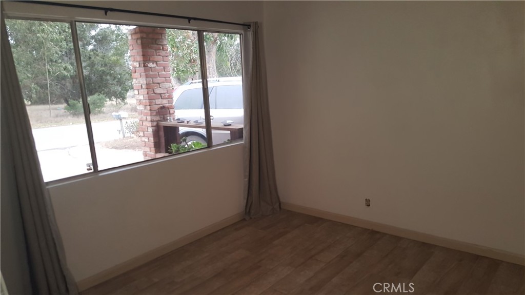611 Los Osos Valley Road Los Osos, CA 93402 - Photo 13 of 13 a view of a room that has wooden floor and a window