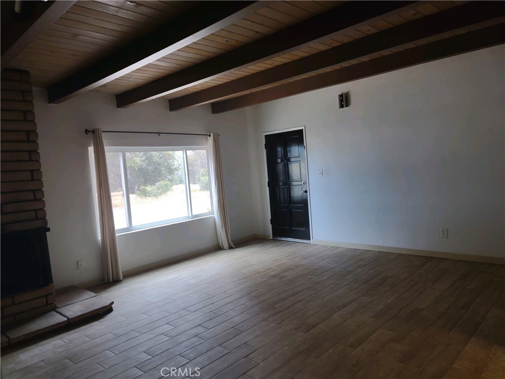 611 Los Osos Valley Road Los Osos, CA 93402 - Photo 8 of 13 a view of an empty room with wooden floor and a window