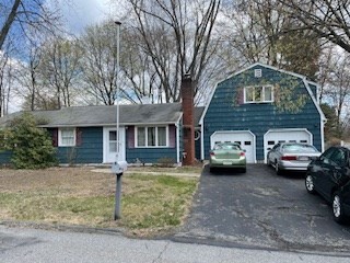 41 Elizabeth Road Billerica, MA 01821 - Photo 1 of 18 a front view of a house with parking space