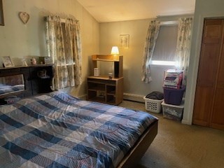 41 Elizabeth Road Billerica, MA 01821 - Photo 7 of 18 a bedroom with a bed dresser and a chair