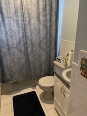 41 Elizabeth Road Billerica, MA 01821 - Photo 10 of 18 a bathroom with a sink a toilet and a shower curtain