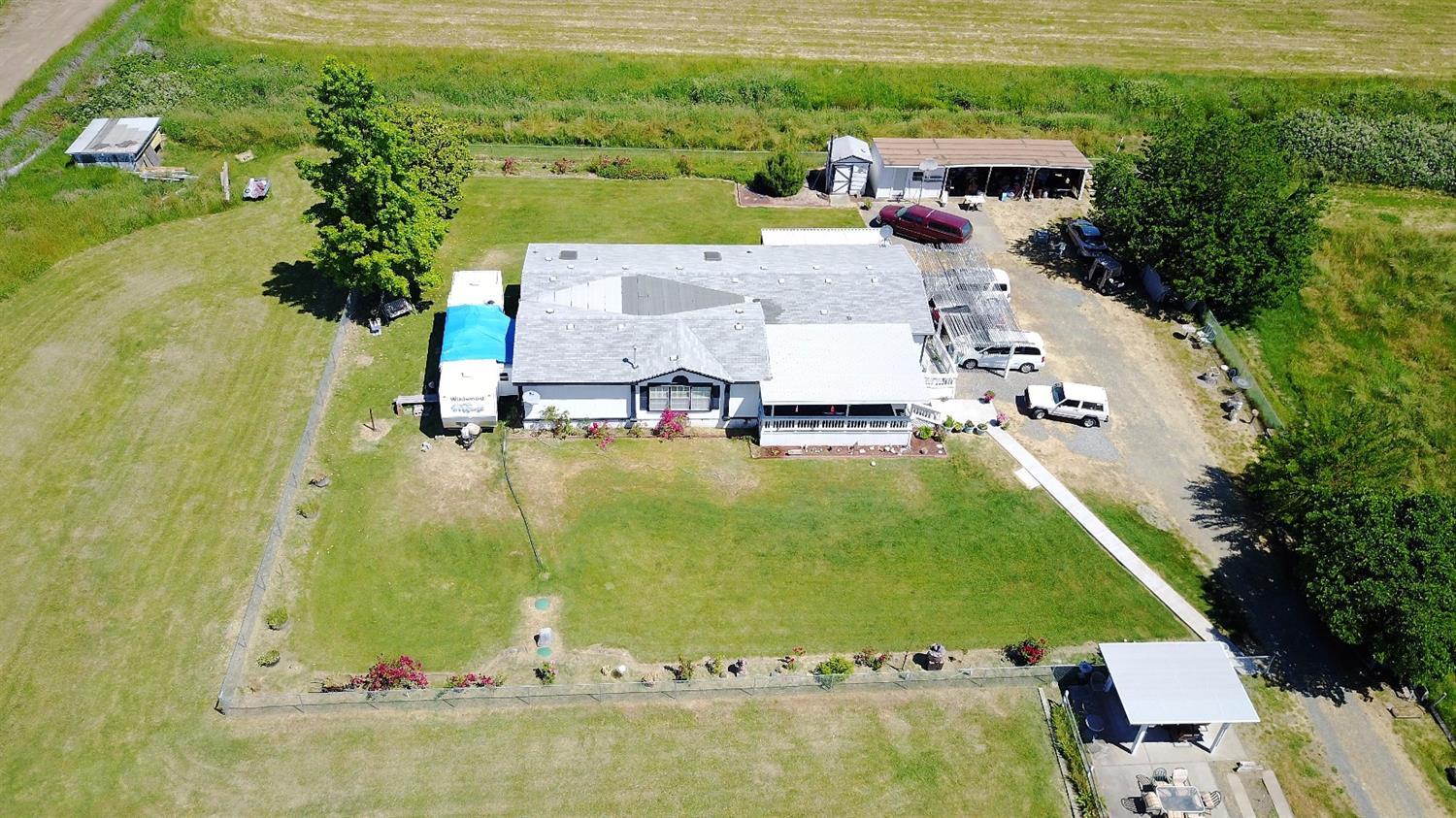 5390 Lower River Road Grants Pass, OR 97526 - Photo 2 of 35 an aerial view of a house with a garden