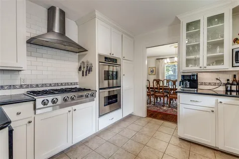 a kitchen with cabinets and appliances