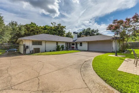 a house with swimming pool in front of it