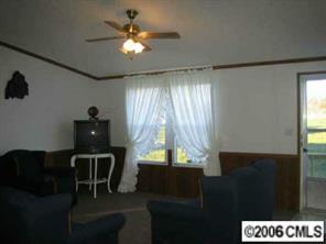 1377 Colonial Road Clover, SC 29710 - Photo 7 of 8 a view of a dining room with furniture and a chandelier fan