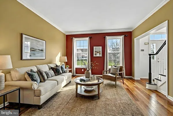 a view of a room with wooden floor and window