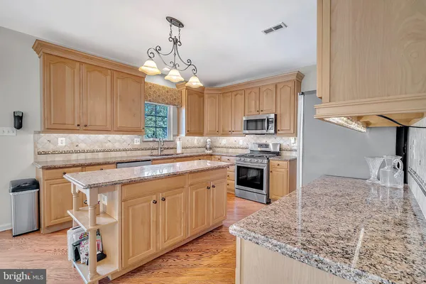 a dining room with furniture window wooden floor