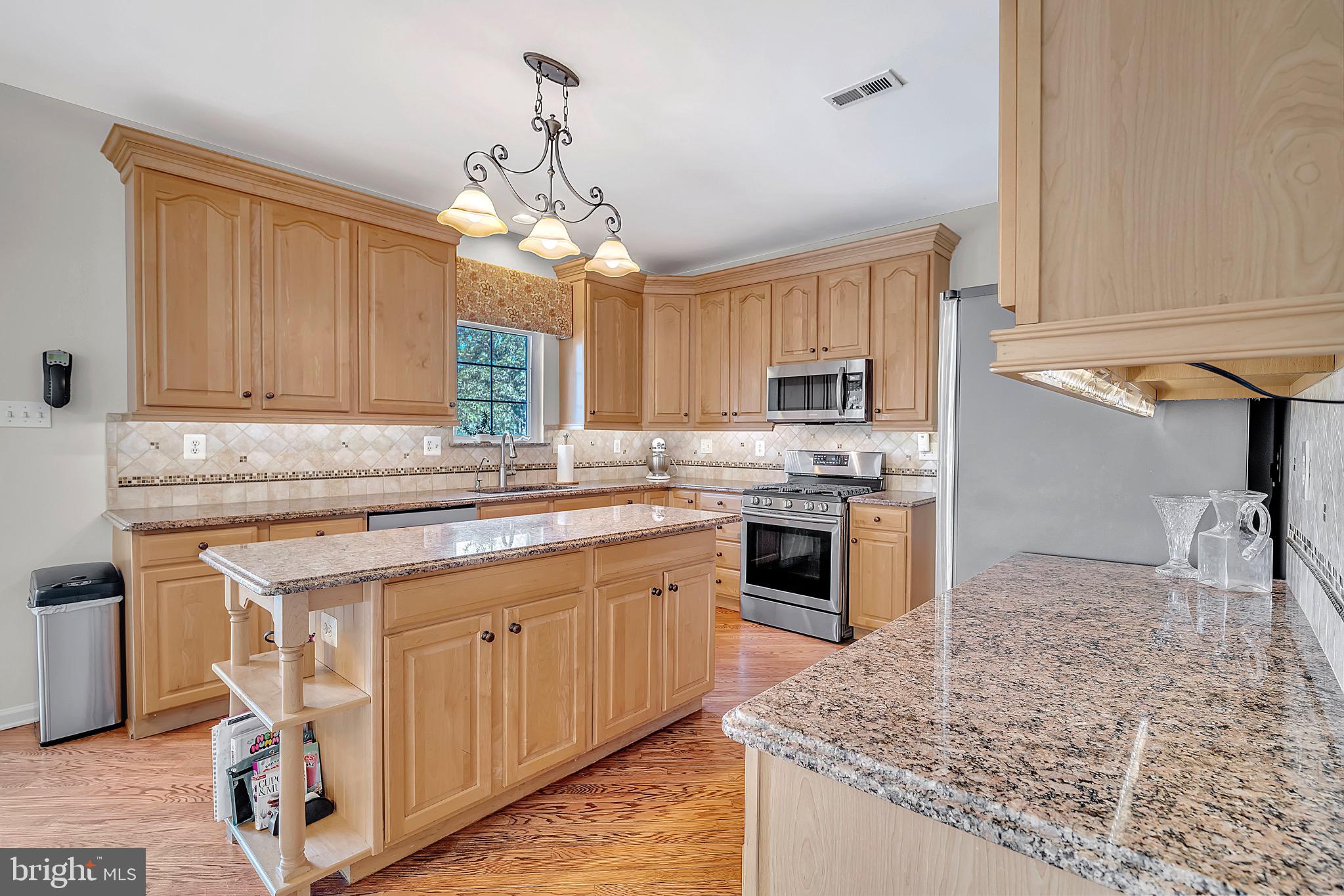 7 Anderson Lane Robbinsville, NJ 08691 - Photo 23 of 54 Warm wood tones in a spacious kitchen.