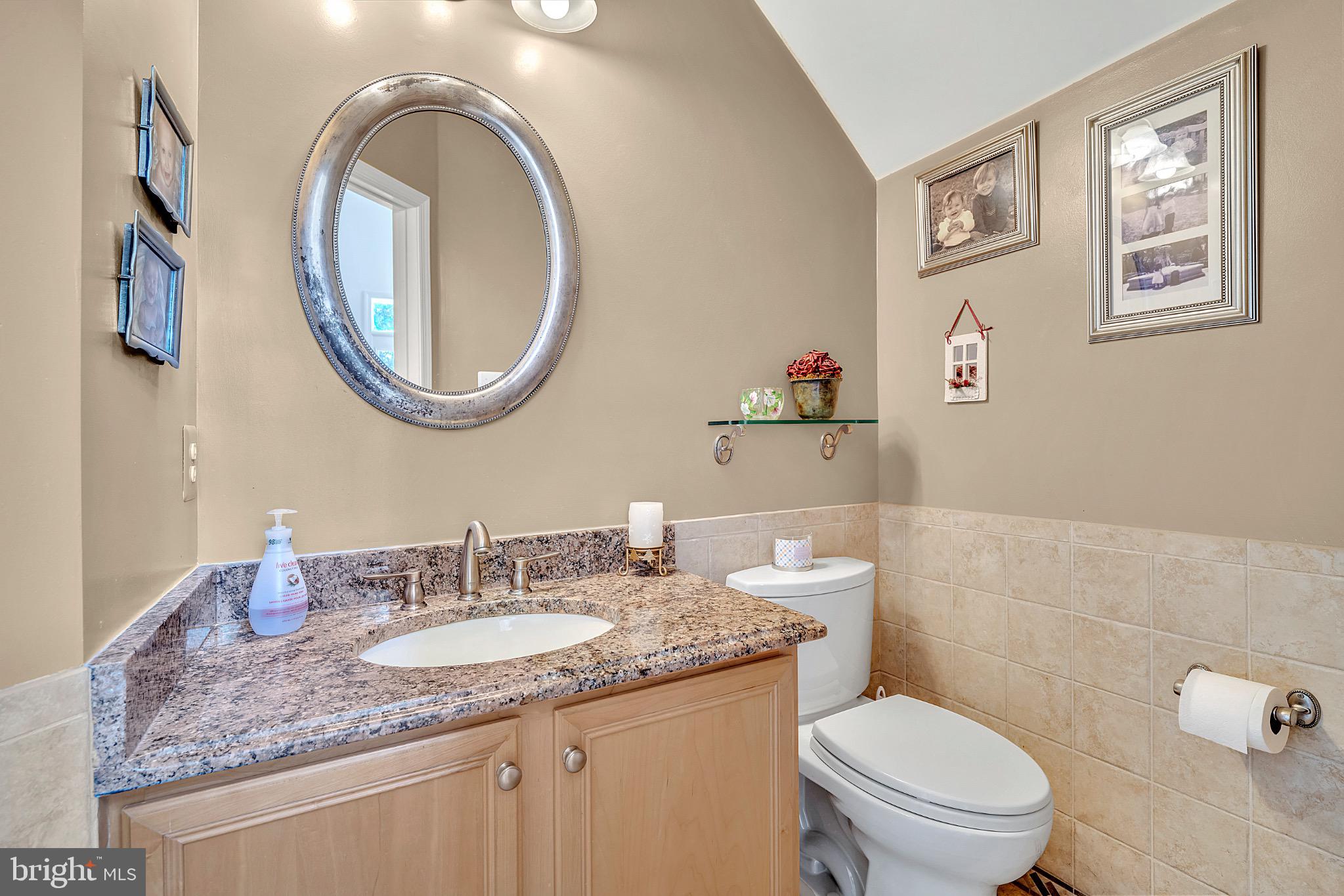 7 Anderson Lane Robbinsville, NJ 08691 - Photo 27 of 54 a bathroom with a granite countertop toilet a sink and a mirror