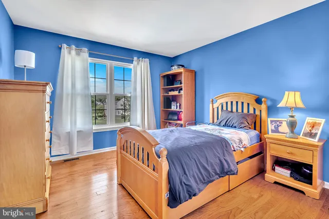 a living room with furniture and gym equipment