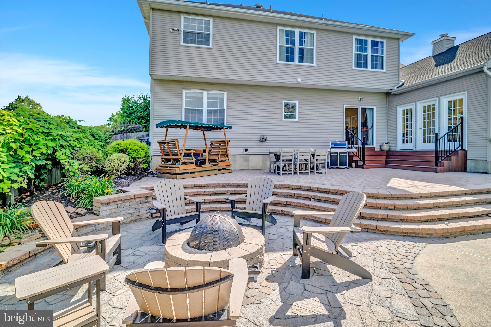 7 Anderson Lane Robbinsville, NJ 08691 - Photo 45 of 54 a view of a patio with couches table and chairs and potted plants