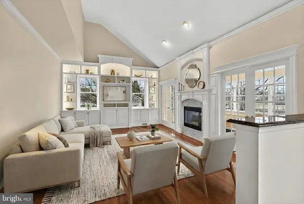 a living room with furniture fireplace and flat screen tv