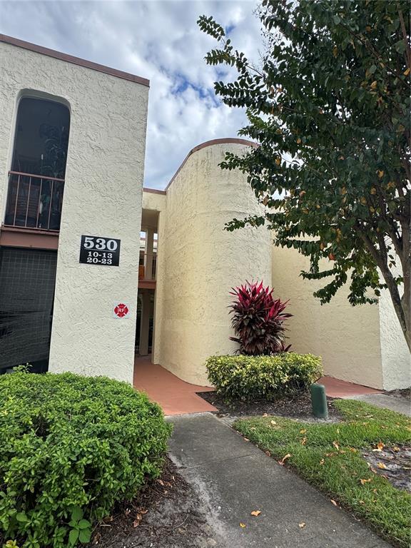 530 Orange Drive, Unit 23 Altamonte Springs, FL 32701 - Photo 2 of 15 a front view of a house with a yard