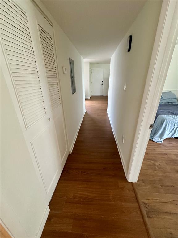 530 Orange Drive, Unit 23 Altamonte Springs, FL 32701 - Photo 6 of 15 a view of a hallway with wooden floor and staircase
