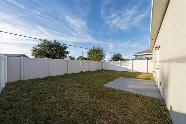 a backyard of a house with lots of green space