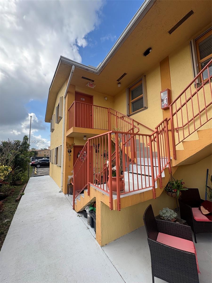 231 East 7th Street, Unit 202 Hialeah, FL 33010 - Photo 3 of 7 a view of outdoor space with porch and furniture