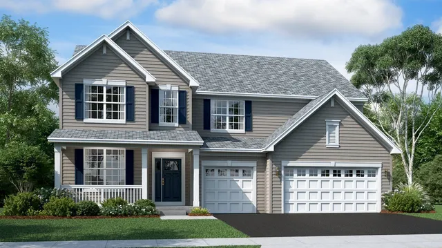 a view of a house with yard and plants