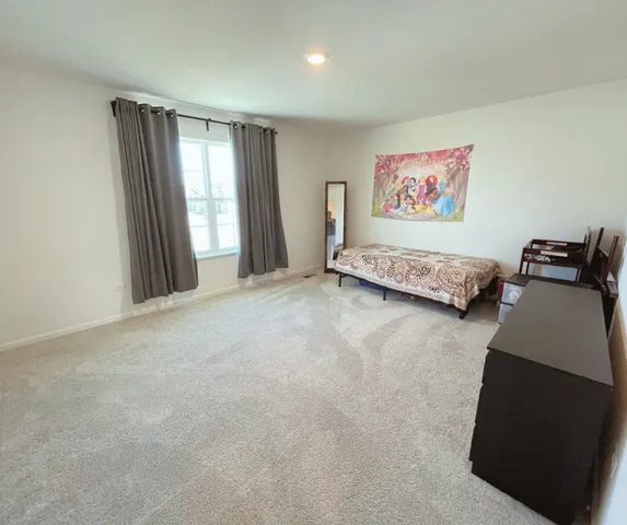 a view of a livingroom with furniture and window