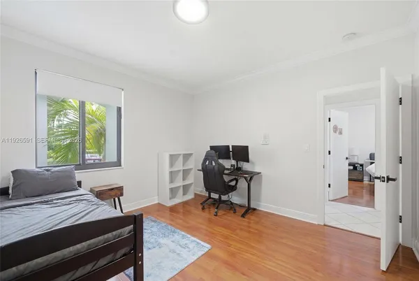a livingroom with workspace and a window
