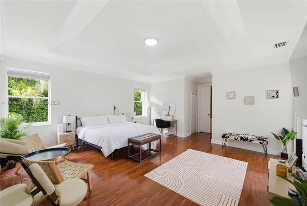 a bed room with furniture and a window