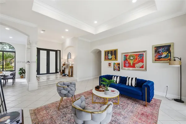 a living room with furniture and a table