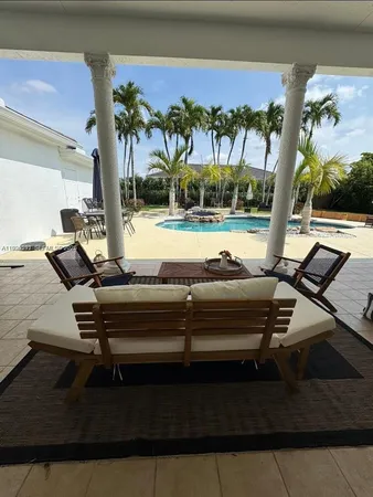 a view of a terrace with furniture