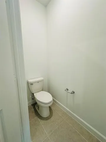 a bathroom with a sink a mirror a vanity and a shower
