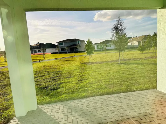 a living room filled with furniture and a chandelier