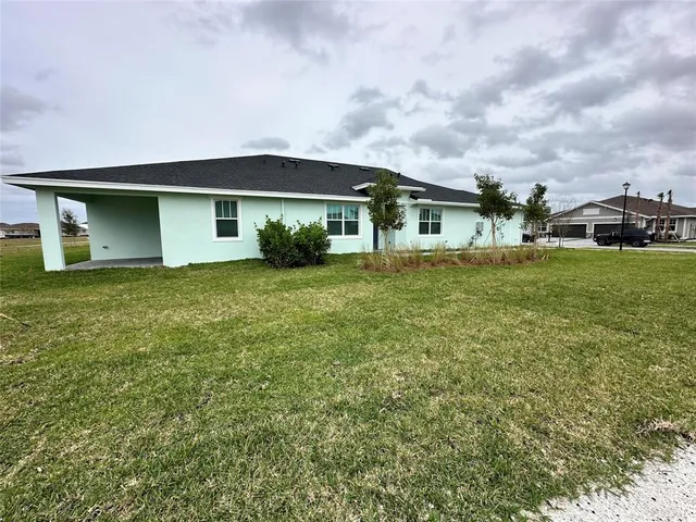 front view of a house with a yard