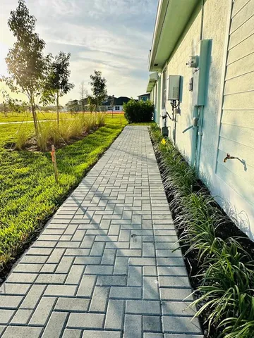 a view of a livingroom with a ceiling fan and window