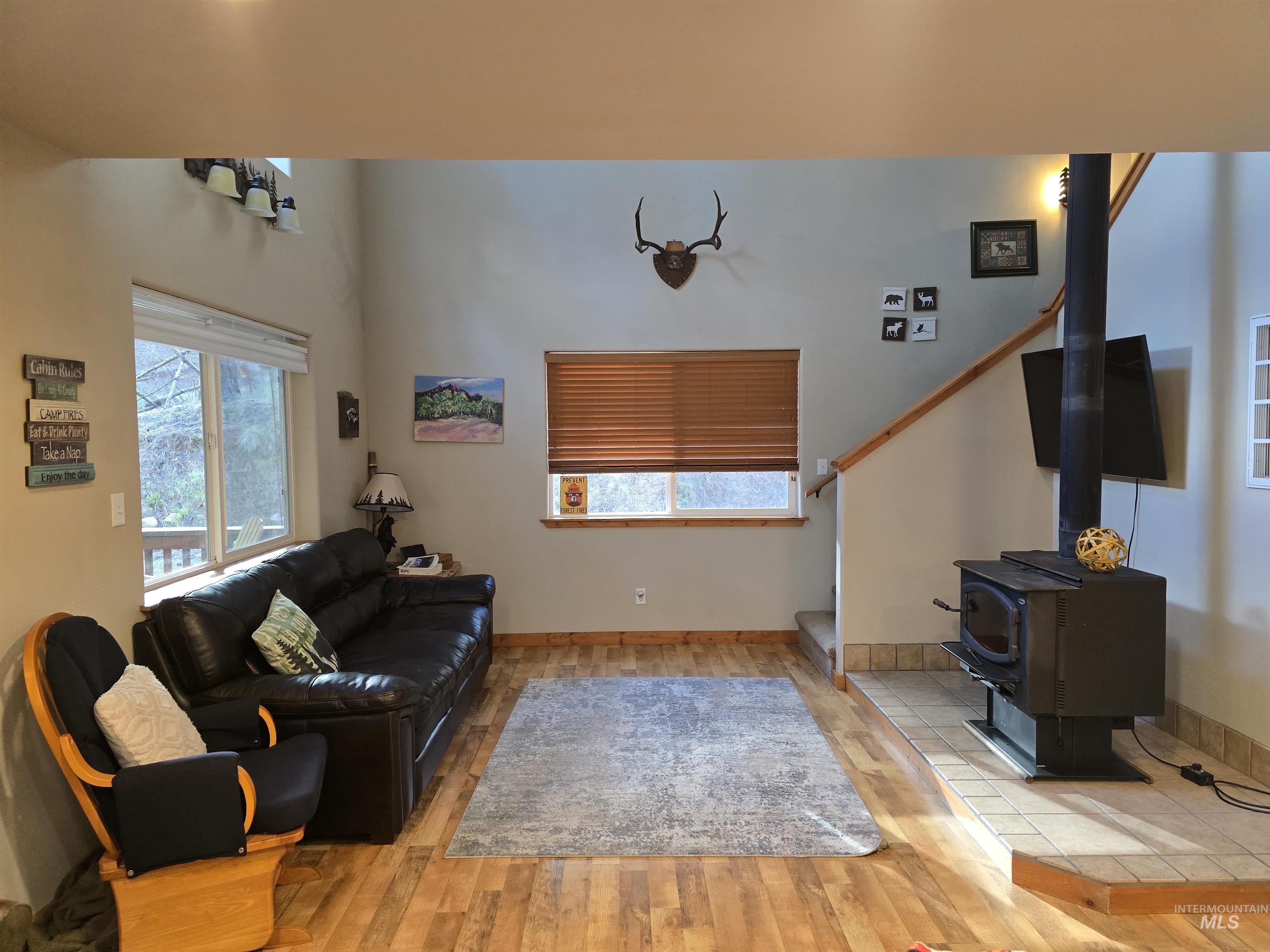 14 Forest Trail Road Garden Valley, ID 83622 - Photo 14 of 45 Living room with light wood-style floors and a wood stove