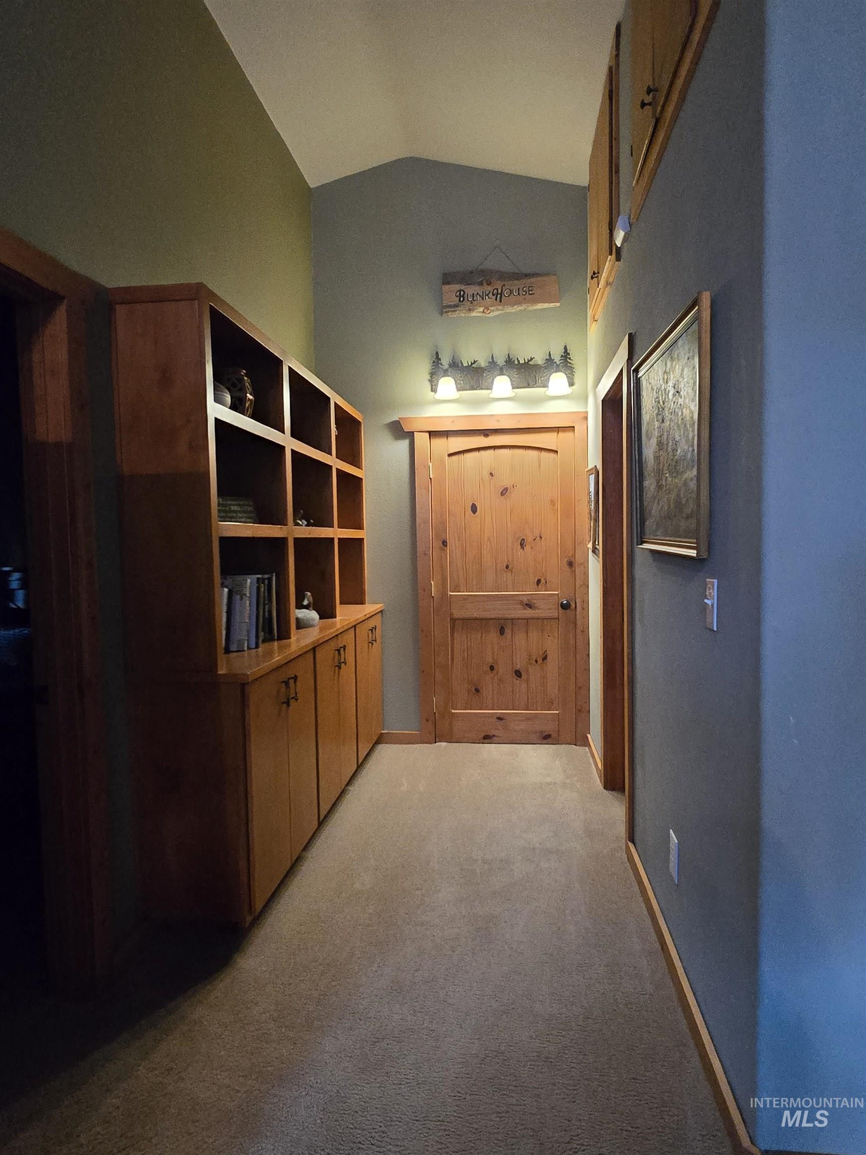 14 Forest Trail Road Garden Valley, ID 83622 - Photo 32 of 45 Corridor featuring lofted ceiling and light colored carpet