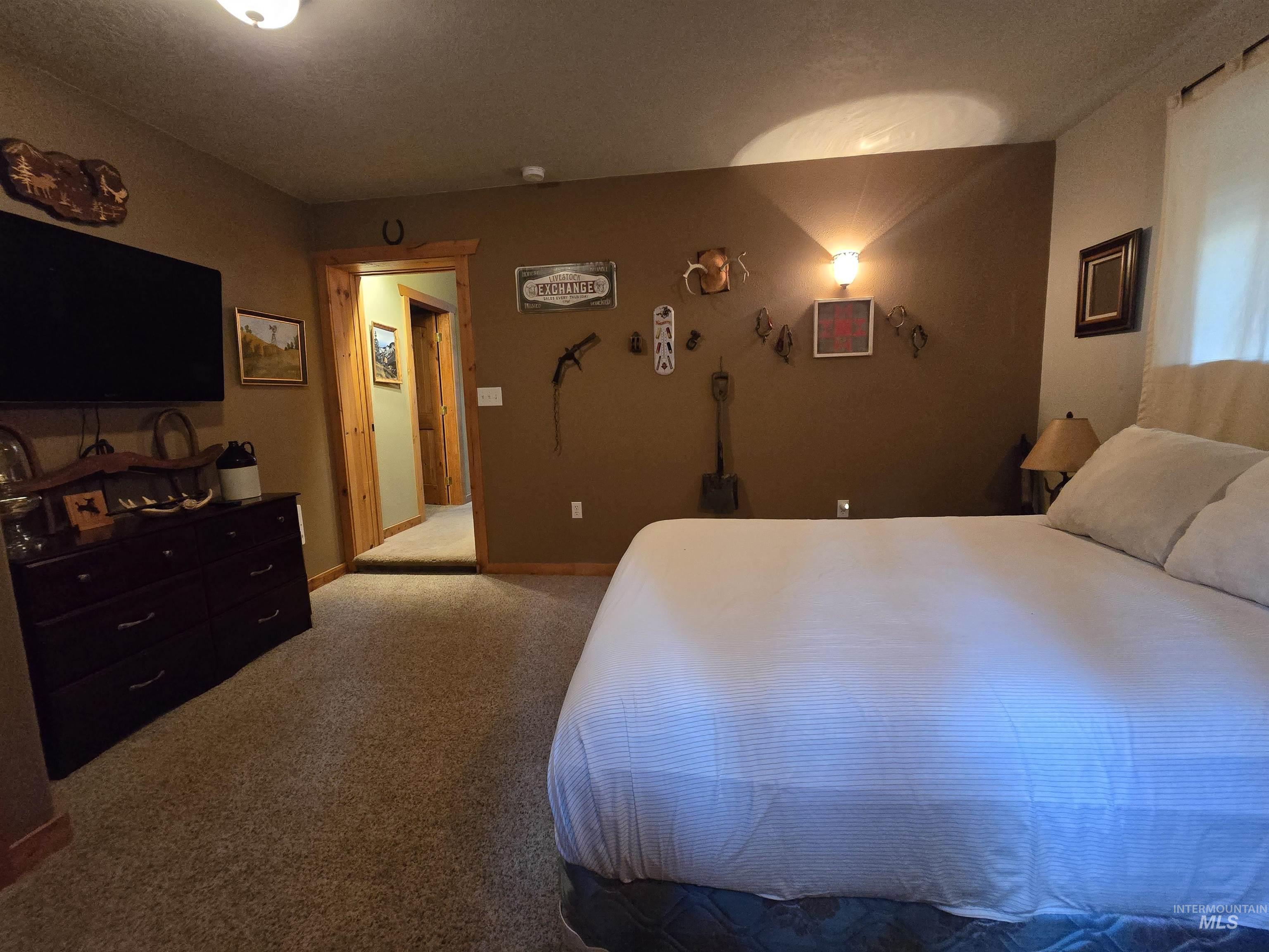 14 Forest Trail Road Garden Valley, ID 83622 - Photo 34 of 45 Bedroom featuring light colored carpet and baseboards