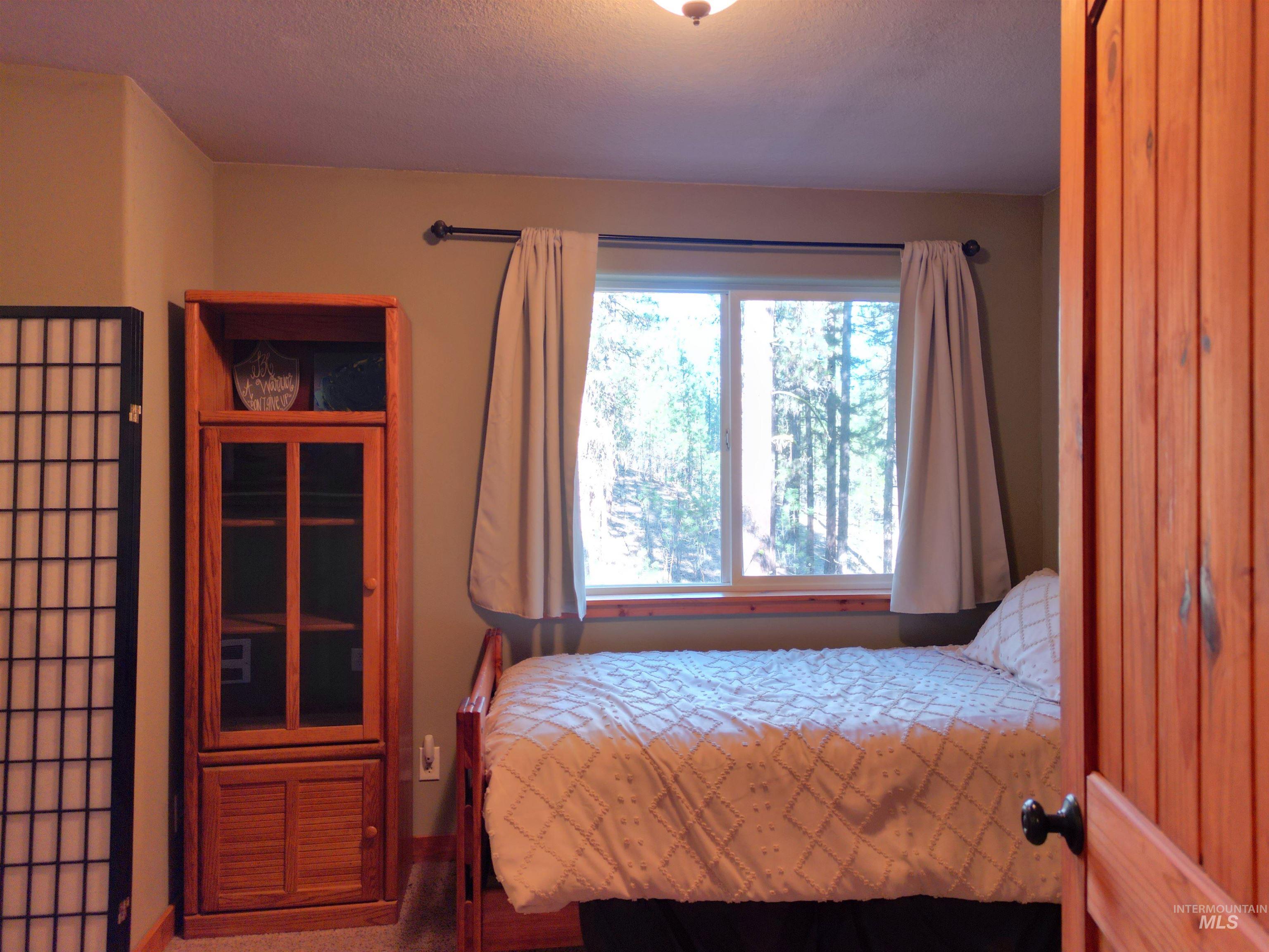 14 Forest Trail Road Garden Valley, ID 83622 - Photo 39 of 45 Bedroom featuring baseboards and carpet