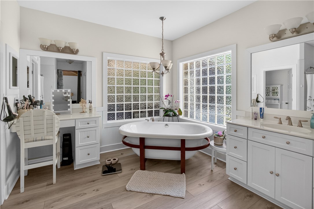 1504 Double Springs Road Townville, SC 29689 - Photo 13 of 41 Luxurious bathroom retreat features a freestanding tub and ample vanity space for serene moments.