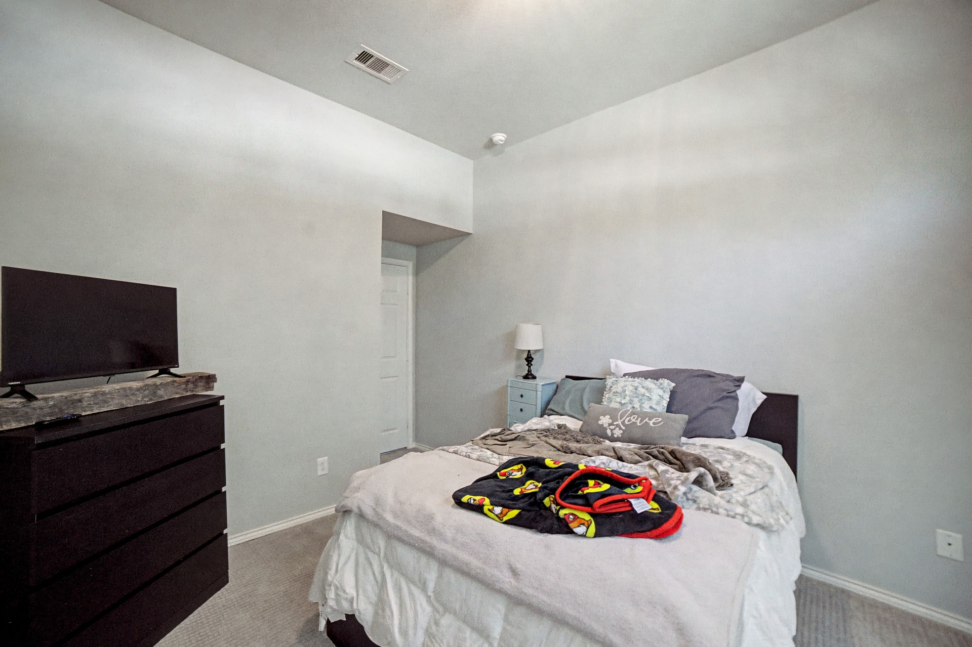 28411 Peper Hollow Lane Spring, TX 77386 - Photo 18 of 24 a bedroom with a bed and a flat screen tv