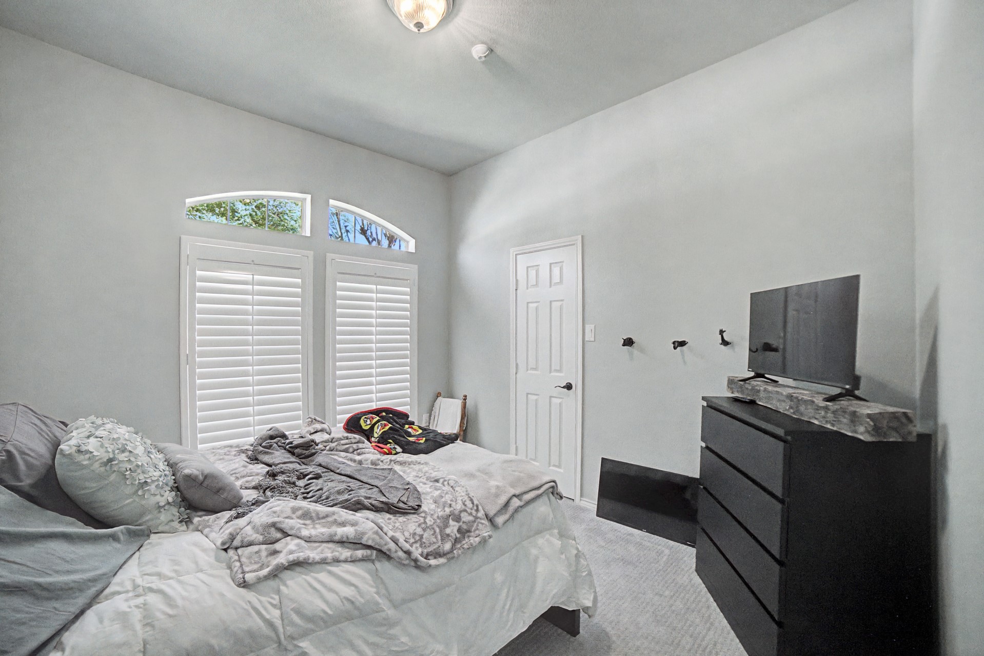 28411 Peper Hollow Lane Spring, TX 77386 - Photo 19 of 24 a bedroom with a bed and a flat screen tv