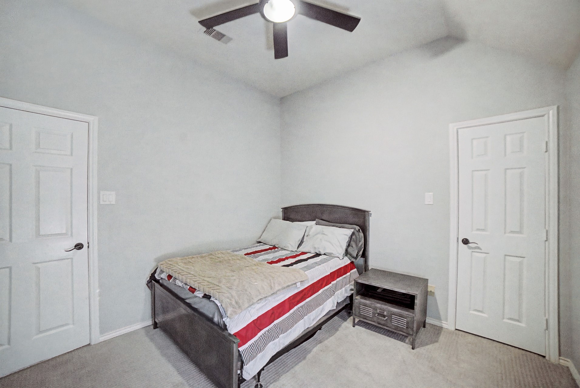28411 Peper Hollow Lane Spring, TX 77386 - Photo 20 of 24 a bedroom with a bed and a chandelier
