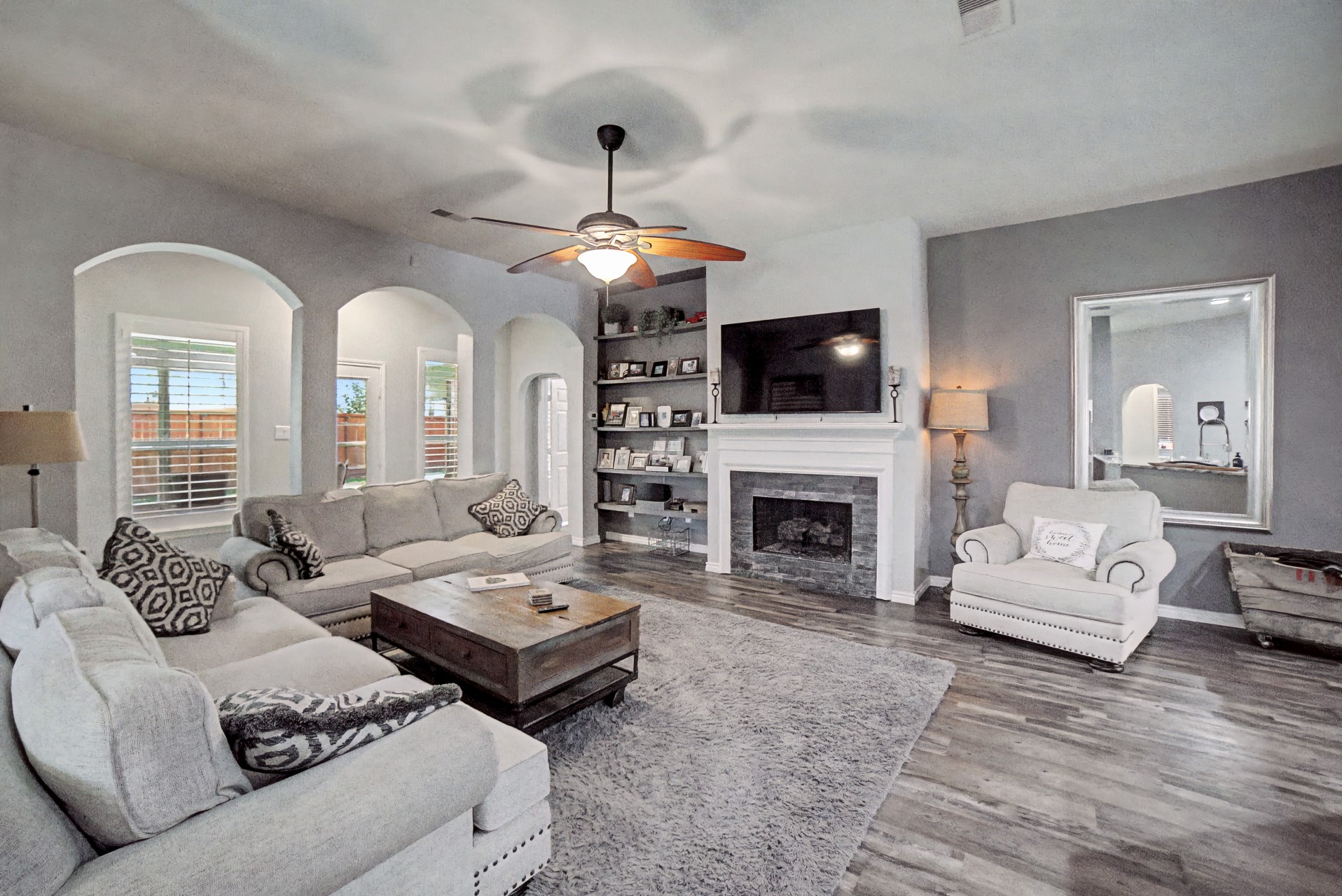 28411 Peper Hollow Lane Spring, TX 77386 - Photo 2 of 24 a living room with furniture a fireplace and a flat screen tv