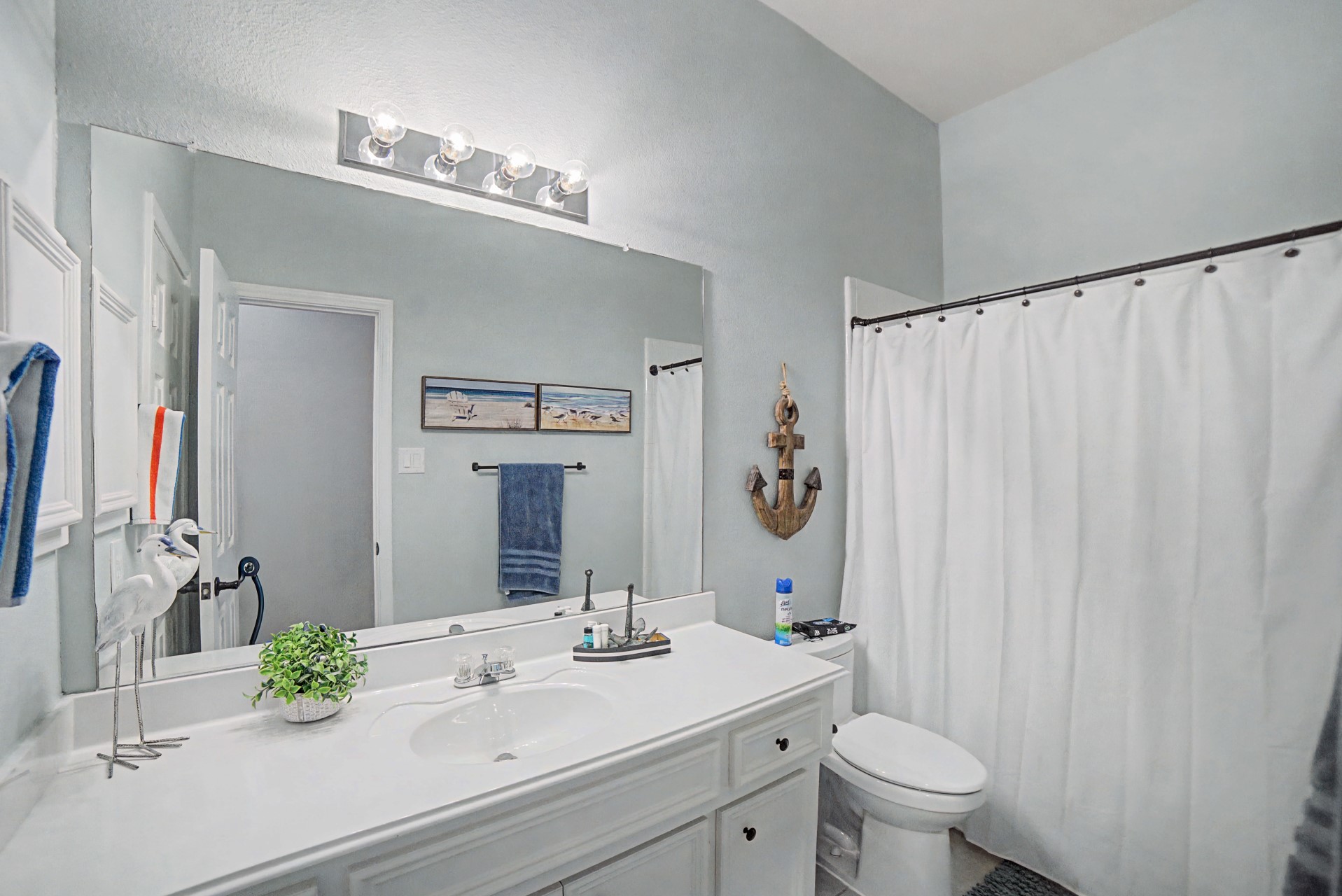 28411 Peper Hollow Lane Spring, TX 77386 - Photo 22 of 24 a bathroom with a sink a toilet and a mirror