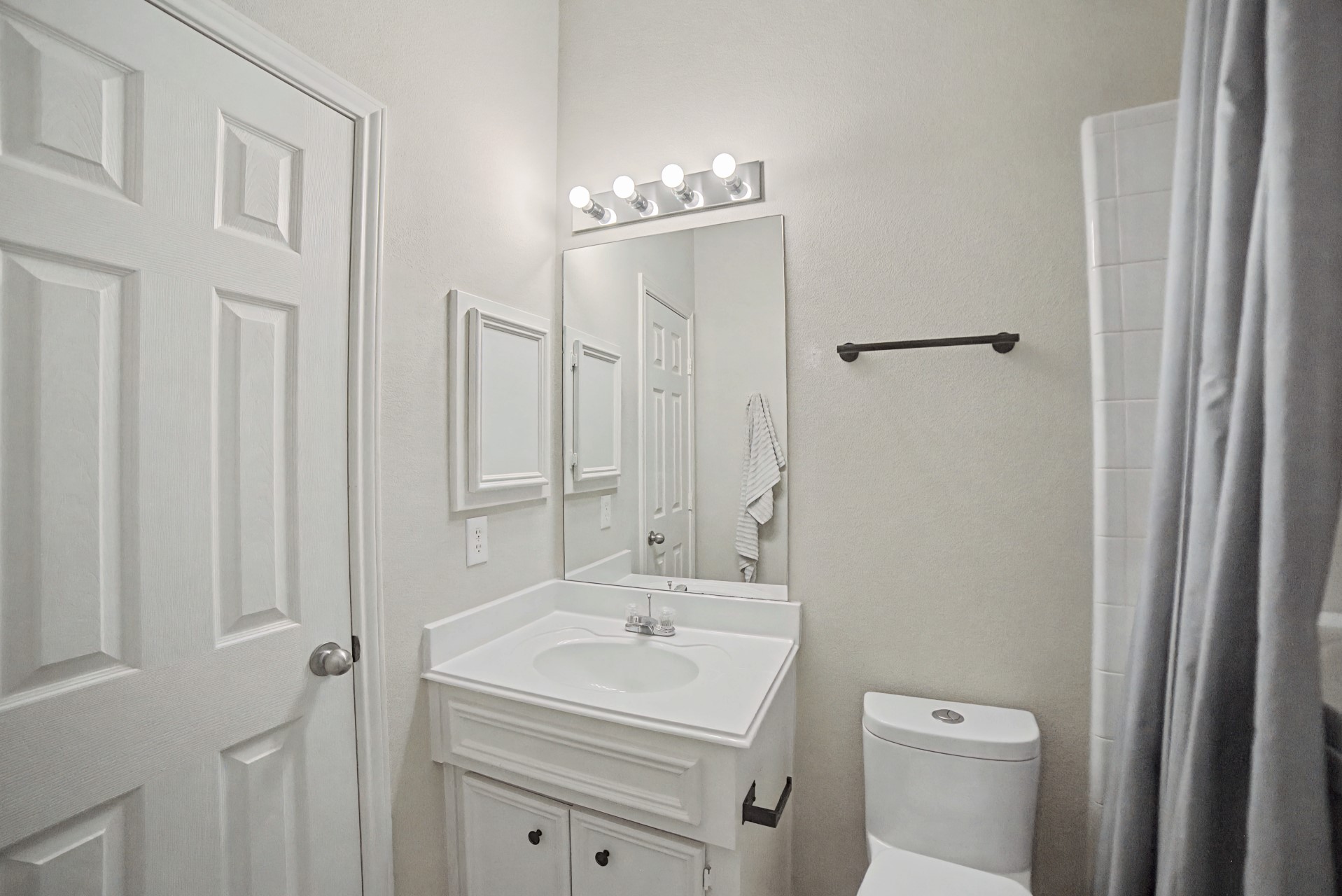 28411 Peper Hollow Lane Spring, TX 77386 - Photo 6 of 24 a bathroom with a sink a toilet and a mirror